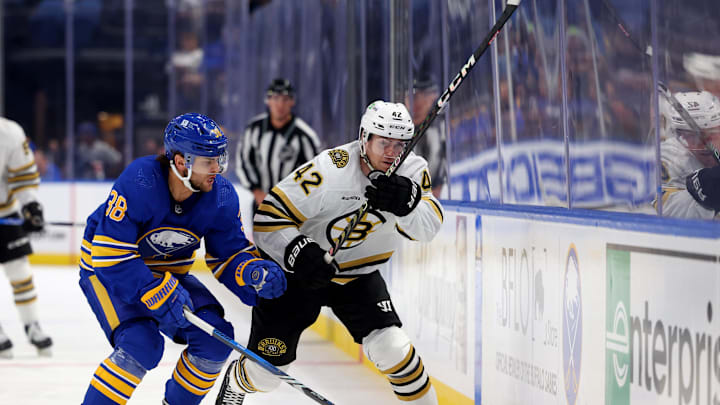 Sep 26, 2023; Buffalo, New York, USA;  Boston Bruins center Georgii Merkulov (42) clears the puck during a preseason game against the Buffalo Sabres