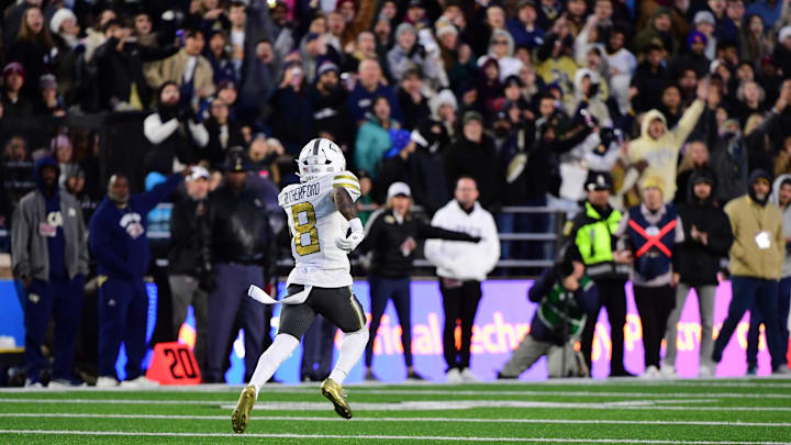 Nov 15, 2025; Chestnut Hill, Massachusetts, USA; Georgia Tech Yellow Jackets wide receiver Malik Rutherford (8) runs with the ball for a touchdown during the first half against the Boston College Eagles at Alumni Stadium. Mandatory Credit: Bob DeChiara-Imagn Images