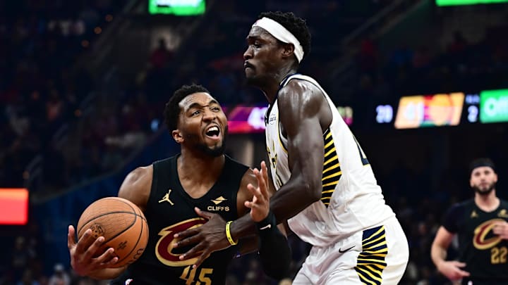 Nov 21, 2025; Cleveland, Ohio, USA; Cleveland Cavaliers guard Donovan Mitchell (45) drives to the basket against Indiana Pacers forward Pascal Siakam (43) during the first half at Rocket Arena. Mandatory Credit: Ken Blaze-Imagn Images