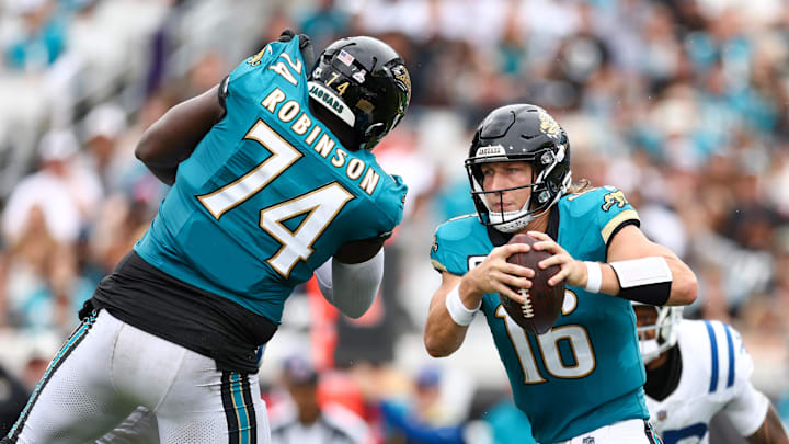 Oct 6, 2024; Jacksonville, Florida, USA; Jacksonville Jaguars quarterback Trevor Lawrence (16) runs with the ball against the Indianapolis Colts in the fourth quarter at EverBank Stadium. Mandatory Credit: Nathan Ray Seebeck-Imagn Images