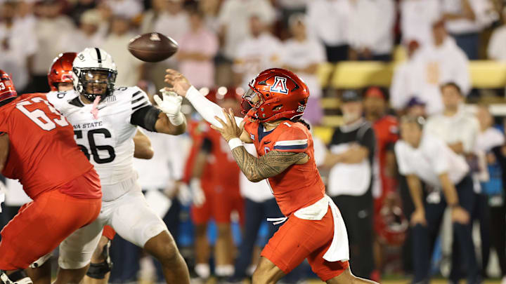 Sep 27, 2025; Ames, Iowa, USA; Arizona Wildcats quarterback Noah Fifita (1) throws a pass against the Iowa State Cyclones during the second half at Jack Trice Stadium. Mandatory Credit: Reese Strickland-Imagn Images