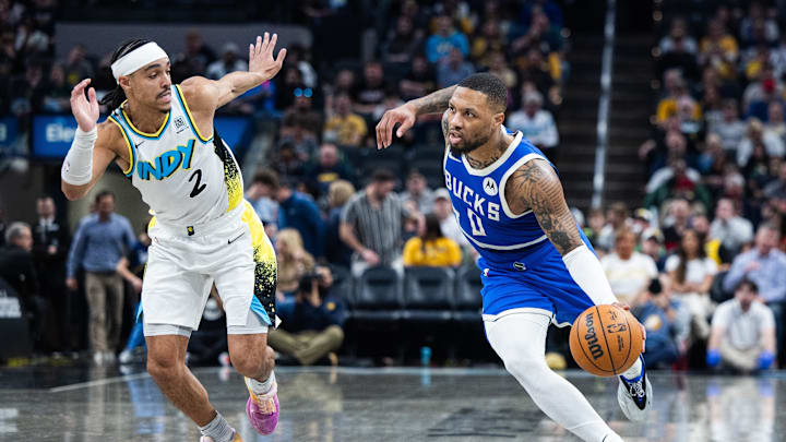 Mar 11, 2025; Indianapolis, Indiana, USA; Milwaukee Bucks guard Damian Lillard (0) dribbles the ball while Indiana Pacers guard Andrew Nembhard (2) defends in the second half at Gainbridge Fieldhouse. Mandatory Credit: Trevor Ruszkowski-Imagn Images Mar 11, 2025; Indianapolis, Indiana, USA; Milwaukee Bucks guard Damian Lillard (0) dribbles the ball while Indiana Pacers guard Andrew Nembhard (2) defends in the second half at Gainbridge Fieldhouse. Mandatory Credit: Trevor Ruszkowski-Imagn Images