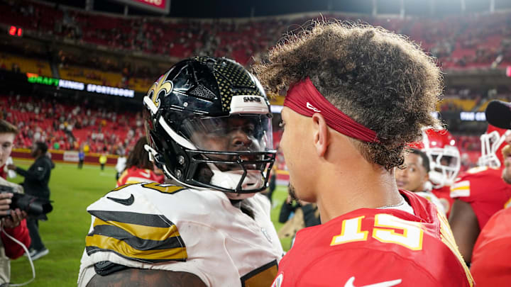 Oct 7, 2024; Kansas City, Missouri, USA; Kansas City Chiefs quarterback Patrick Mahomes (15) talks with New Orleans Saints defensive tackle Khalen Saunders (50) after the game at GEHA Field at Arrowhead Stadium. Mandatory Credit: Denny Medley-Imagn Images