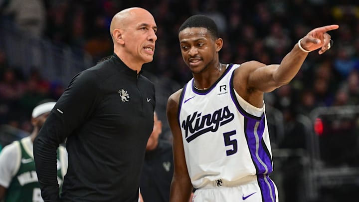 Jan 14, 2025; Milwaukee, Wisconsin, USA; Sacramento Kings guard De'Aaron Fox (5) talks to interim head coach Doug Christie in the second quarter against the Milwaukee Bucks at Fiserv Forum. Mandatory Credit: Benny Sieu-Imagn Images