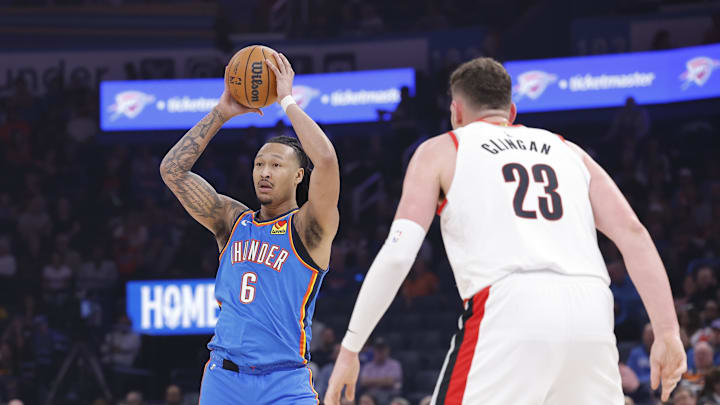 Mar 7, 2025; Oklahoma City, Oklahoma, USA; Oklahoma City Thunder forward Jaylin Williams (6) passes the ball in front of Portland Trail Blazers center Donovan Clingan (23) during the first quarter at Paycom Center. Mandatory Credit: Alonzo Adams-Imagn Images