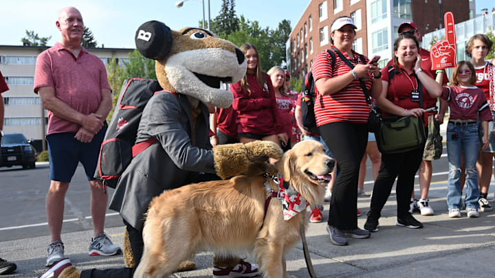 Sep 7, 2024; Pullman, Washington, USA; Washington State Cougars mascot Butch poses for a photo with Chase a Golden Retriever outside Gesa Field at Martin Stadium. Mandatory Credit: James Snook-Imagn Images