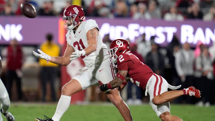 The ball goes past Alabama Crimson Tide tight end CJ Dippre (81) as Oklahoma Sooners defensive back Billy Bowman Jr. (2) defends during a college football game between the University of Oklahoma Sooners (OU) and the Alabama Crimson Tide at Gaylord Family - Oklahoma Memorial Stadium in Norman, Okla., Saturday, Nov. 23, 2024. Oklahoma won 24-3.