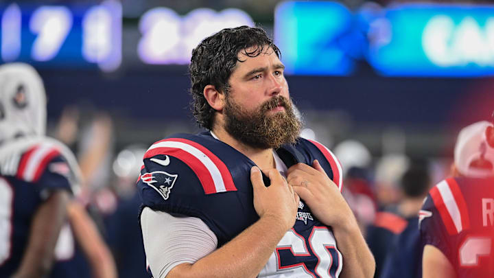 New England Patriots center David Andrews (60) watches from the sideline during the first half against the Carolina Panthers at Gillette Stadium.
