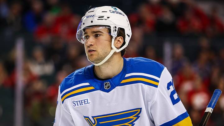 Mar 18, 2026; Calgary, Alberta, CAN; St. Louis Blues right wing Jimmy Snuggerud (21) against the Calgary Flames during the third period at Scotiabank Saddledome. Mandatory Credit: Sergei Belski-Imagn Images Mar 18, 2026; Calgary, Alberta, CAN; St. Louis Blues right wing Jimmy Snuggerud (21) against the Calgary Flames during the third period at Scotiabank Saddledome. Mandatory Credit: Sergei Belski-Imagn Images