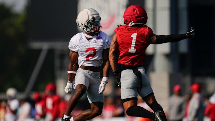 Ohio State Buckeyes safety Caleb Downs (2) and Ohio State Buckeyes wide receiver Brandon Inniss (1) do a handshake during football training camp at the Woody Hayes Athletic Center on Aug. 1, 2025.