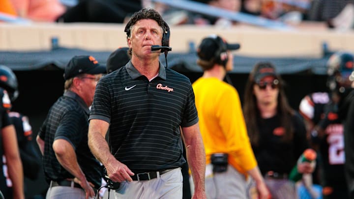 Sep 19, 2025; Stillwater, Oklahoma, USA; Oklahoma State Cowboys coach Mike Gundy on the sidelines during the first half against the Tulsa Golden Hurricane at Boone Pickens Stadium. Mandatory Credit: William Purnell-Imagn Images Sep 19, 2025; Stillwater, Oklahoma, USA; Oklahoma State Cowboys coach Mike Gundy on the sidelines during the first half against the Tulsa Golden Hurricane at Boone Pickens Stadium. Mandatory Credit: William Purnell-Imagn Images