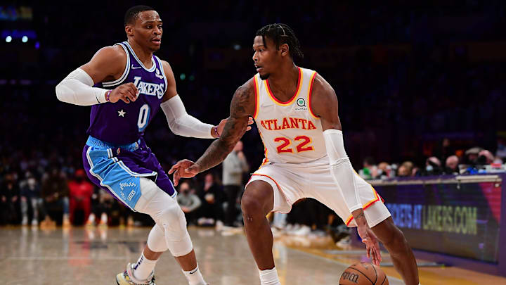 Jan 7, 2022; Los Angeles, California, USA; Atlanta Hawks forward Cam Reddish (22) moves the ball against Los Angeles Lakers guard Russell Westbrook (0) during the first half at Crypto.com Arena. Mandatory Credit: Gary A. Vasquez-Imagn Images