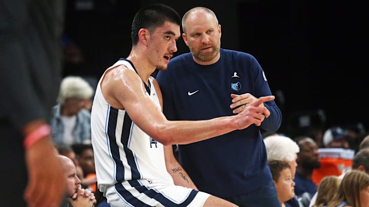 Oct 10, 2024; Memphis, Tennessee, USA; Memphis Grizzlies center Zach Edey (14) talks with head coach Taylor Jenkins during the second half against the Charlotte Hornets at FedExForum. Mandatory Credit: Petre Thomas-Imagn Images