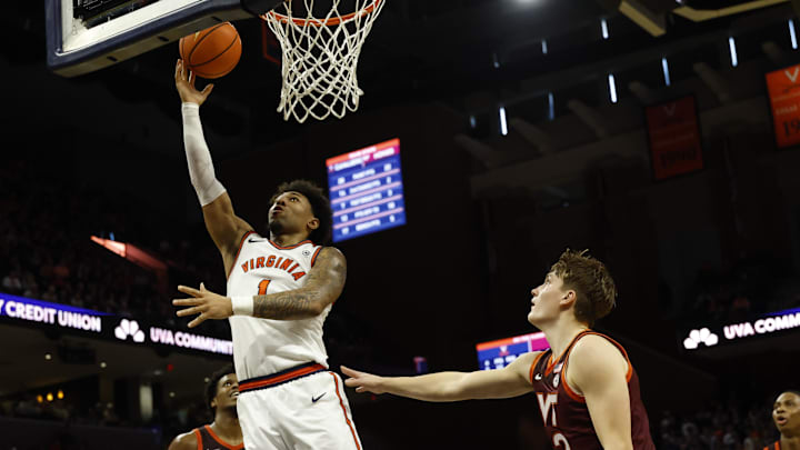 Mar 7, 2026; Charlottesville, Virginia, USA; Virginia Cavaliers guard Malik Thomas (1) shoots the ball as Virginia Tech Hokies guard Jaden Schutt (2) defends in the second half at John Paul Jones Arena. Mandatory Credit: Geoff Burke-Imagn Images