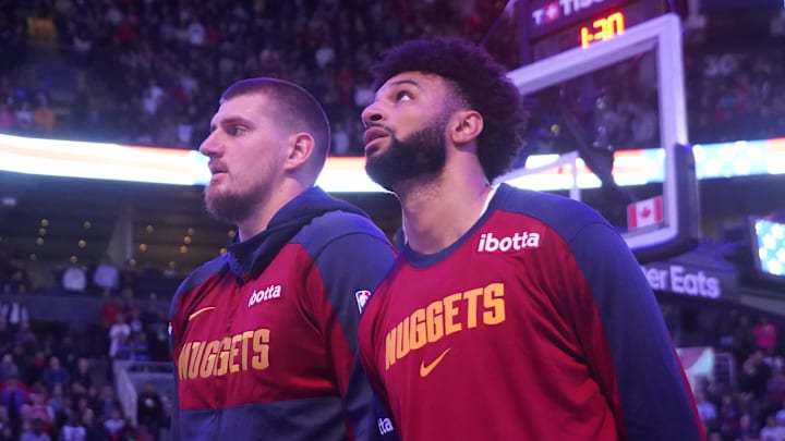 Denver Nuggets center Nikola Jokic (left) and guard Jamal Murray (right) during the anthems before a game against the Toronto Raptors at Scotiabank Arena. Denver Nuggets center Nikola Jokic (left) and guard Jamal Murray (right) during the anthems before a game against the Toronto Raptors at Scotiabank Arena.