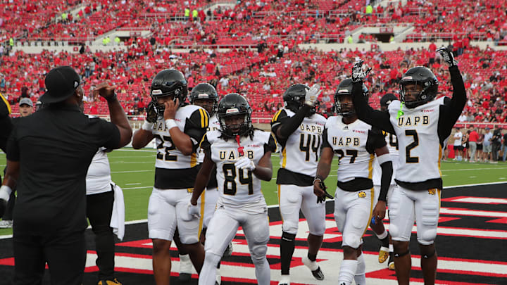 Aug 30, 2025; Lubbock, Texas, USA;  Members of the Arkansas-Pine Bluff Golden Lions leave the field after warm ups before the game against the Texas Tech Red Raiders at Jones AT&T Stadium. Mandatory Credit: Michael C. Johnson-Imagn Images