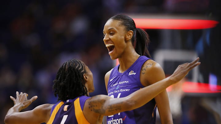 Mercury forward DeWanna Bonner, right, celebrates with Yvonne Turner after hitting 40-footer to end the third quarter on Sunday against the Los Angeles Sparks at Talking Stick Resort Arena in Phoenix.

Phoenix Mercury Vs Los Angeles Sparks