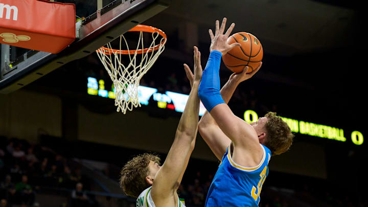 UCLA forward Tyler Bilodeau goes up over Oregon forward Luke Johnson as the Oregon Ducks host the UCLA Bruins on Jan. 28, 2026, at Matthew Knight Arena in Eugene, Oregon.