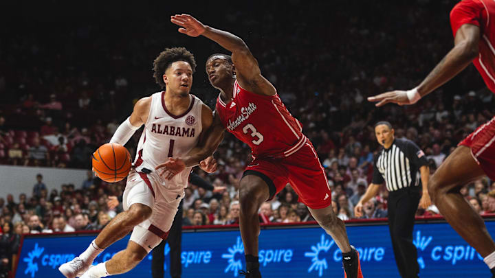 Nov 8, 2024; Tuscaloosa, Alabama, USA; Alabama Crimson Tide guard Mark Sears (1) drives the ball against Arkansas State Red Wolves guard Derrian Ford (3) during the second half at Coleman Coliseum. Mandatory Credit: Will McLelland-Imagn Images Nov 8, 2024; Tuscaloosa, Alabama, USA; Alabama Crimson Tide guard Mark Sears (1) drives the ball against Arkansas State Red Wolves guard Derrian Ford (3) during the second half at Coleman Coliseum. Mandatory Credit: Will McLelland-Imagn Images