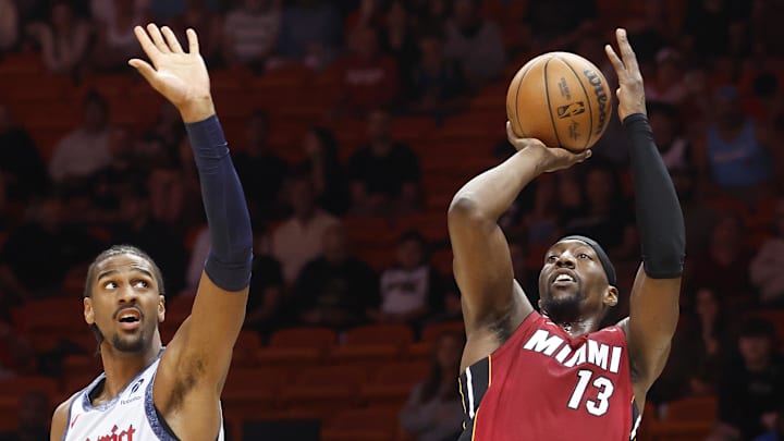 Mar 3, 2025; Miami, Florida, USA;  Miami Heat center Bam Adebayo (13) shoots around Washington Wizards forward Alex Sarr (20) during the first half at Kaseya Center. Mandatory Credit: Rhona Wise-Imagn Images