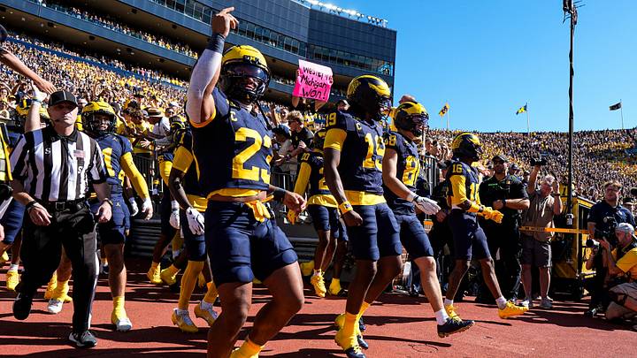 From left, Michigan running back Jordan Marshall (23), quarterback Bryce Underwood (19) and tight end Deakon Tonielli (88) lead the team out of tunnel for  first half against Iowa at Michigan Stadium in Ann Arbor on Saturday, Sept. 26, 2026.