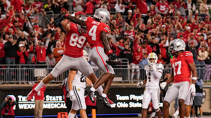 Sep 7, 2024; Columbus, Ohio, USA; Ohio State Buckeyes wide receiver Jeremiah Smith (4) celebrates scoring a touchdown with tight end Will Kacmarek (89) during the first half of the NCAA football game at Ohio Stadium.