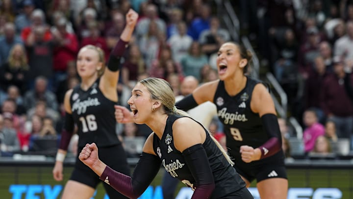 Dec 21, 2025; Kansas City, MO, USA; The Texas A&M Aggies celebrate after winning the first set against the Kentucky Wildcats in the 2025 NCAA Women’s Volleyball Championship at T-Mobile Center. Mandatory Credit: Jay Biggerstaff-Imagn Images Dec 21, 2025; Kansas City, MO, USA; The Texas A&M Aggies celebrate after winning the first set against the Kentucky Wildcats in the 2025 NCAA Women’s Volleyball Championship at T-Mobile Center. Mandatory Credit: Jay Biggerstaff-Imagn Images