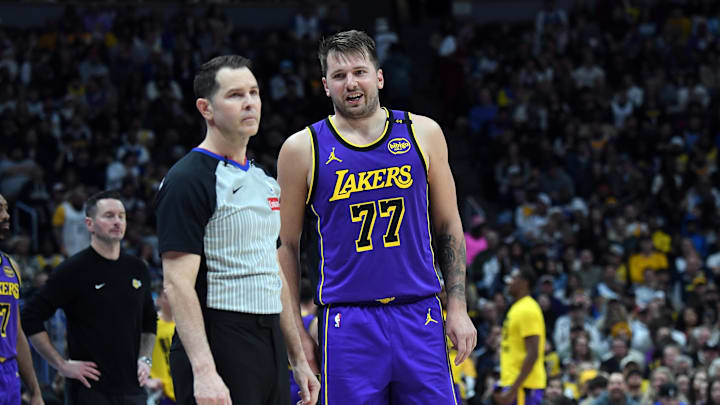 Feb 22, 2025; Denver, Colorado, USA; Los Angeles Lakers guard Luka Doncic (77) talks with an official during a stoppage in play in the first half at Ball Arena. Mandatory Credit: Christopher Hanewinckel-Imagn Images