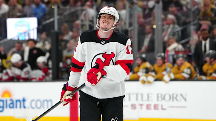 Dec 17, 2025; Las Vegas, Nevada, USA; New Jersey Devils center Cody Glass (12) reacts after being stopped by Vegas Golden Knights goaltender Carter Hart (79) during the third period at T-Mobile Arena. Mandatory Credit: Stephen R. Sylvanie-Imagn Images
