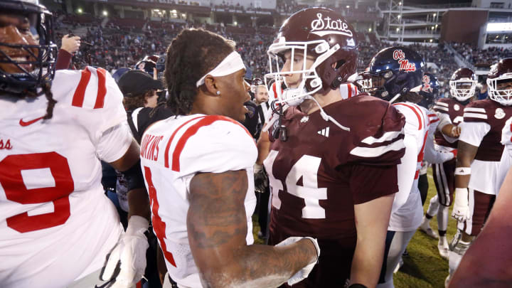 Mississippi Rebels running back Quinshon Judkins (4) and Mississippi State Bulldogs linebacker Jett Johnson (44) talk after the game at Davis Wade Stadium at Scott Field. 
