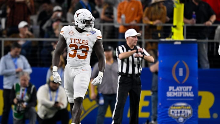 Jan 10, 2025; Arlington, TX, USA; Texas Longhorns linebacker David Gbenda (33) in action during the game between the Texas Longhorns and the Ohio State Buckeyes at AT&T Stadium. Mandatory Credit: Jerome Miron-Imagn Images Jan 10, 2025; Arlington, TX, USA; Texas Longhorns linebacker David Gbenda (33) in action during the game between the Texas Longhorns and the Ohio State Buckeyes at AT&T Stadium. Mandatory Credit: Jerome Miron-Imagn Images