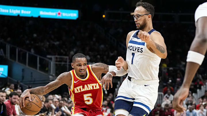 Oct 30, 2023; Atlanta, Georgia, USA; Atlanta Hawks guard Dejounte Murray (5) dribbles against