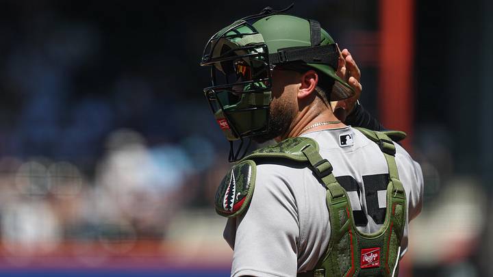 J.C. Escarra looks back during the second inning against the New York Mets at Citi Field. J.C. Escarra looks back during the second inning against the New York Mets at Citi Field.