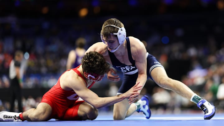 Luke Lilledahl of Penn State wrestles Marcello Milani of Cornell during day one of the NCAA Wrestling championships at Wells Fargo Center. 