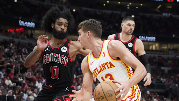 Apr 17, 2024; Chicago, Illinois, USA; Chicago Bulls guard Coby White (0)defends Atlanta Hawks guard
