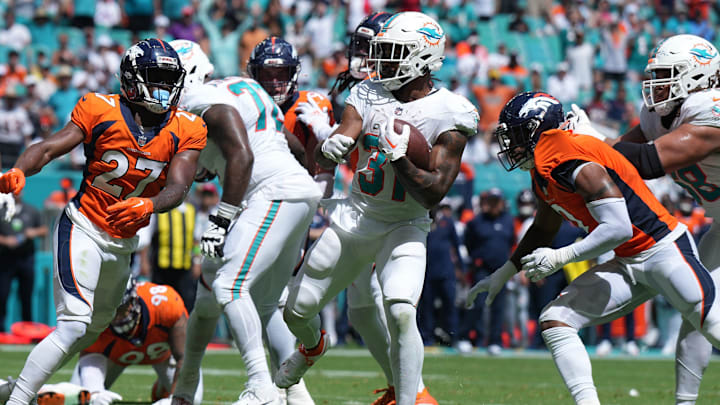 Miami Dolphins running back Raheem Mostert (31) scores a touchdown against the Denver Broncos late