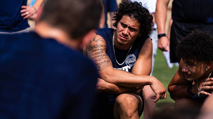 Penn State linebacker Tony Rojas listens to strength and conditioning coach Reid Kagy during the 23rd annual Lift For Life event at Holuba Hall, Penn State linebacker Tony Rojas listens to strength and conditioning coach Reid Kagy during the 23rd annual Lift For Life event at Holuba Hall,
