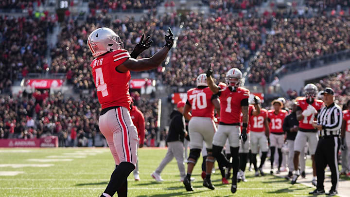 Ohio State Buckeyes wide receiver Jeremiah Smith (4) celebrates a touchdown during the NCAA football game against the Penn State Nittany Lions at Ohio Stadium in Columbus on Nov. 1, 2025. Ohio State Buckeyes wide receiver Jeremiah Smith (4) celebrates a touchdown during the NCAA football game against the Penn State Nittany Lions at Ohio Stadium in Columbus on Nov. 1, 2025.