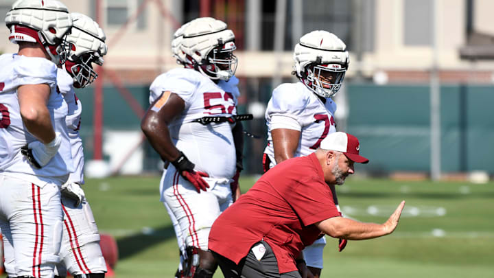 The Crimson Tide players and coaches continue working toward the season opener in practice Tuesday, Aug. 13, 2024. Alabama offensive line coach Chris Kapilovic directs his linemen.