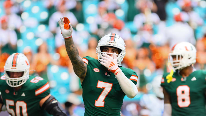 Nov 2, 2024; Miami Gardens, Florida, USA; Miami Hurricanes wide receiver Xavier Restrepo (7) celebrates after a touchdown by wide receiver Jacolby George (not pictured) against the Duke Blue Devils during the fourth quarter at Hard Rock Stadium. Mandatory Credit: Sam Navarro-Imagn Images