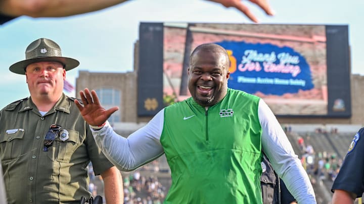 Sep 10, 2022; South Bend, Indiana, USA; Marshall Thundering Herd head coach Charles Huff celebrates as he leaves the field after the Thundering Herd beat the Notre Dame Fighting Irish 26-21 at Notre Dame Stadium. Mandatory Credit: Matt Cashore-USA TODAY Sports