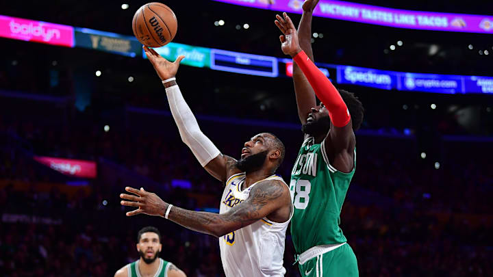 Dec 25, 2023; Los Angeles, California, USA; Los Angeles Lakers forward LeBron James (23) shoots ahead of Boston Celtics center Neemias Queta (88) during the first half at Crypto.com Arena. Mandatory Credit: Gary A. Vasquez-Imagn Images