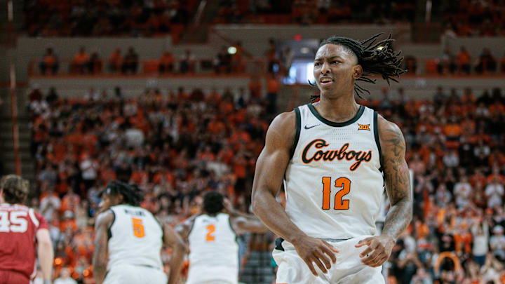Feb 24, 2024; Stillwater, Oklahoma, USA; Oklahoma State Cowboys guard Javon Small (12) reacts after a play during the first half against the Oklahoma Sooners at Gallagher-Iba Arena. Mandatory Credit: William Purnell-Imagn Images