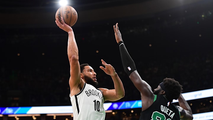 Nov 8, 2024; Boston, Massachusetts, USA;  Brooklyn Nets guard Ben Simmons (10) shoots the ball over Boston Celtics center Neemias Queta (88) during the first half at TD Garden. Mandatory Credit: Bob DeChiara-Imagn Images