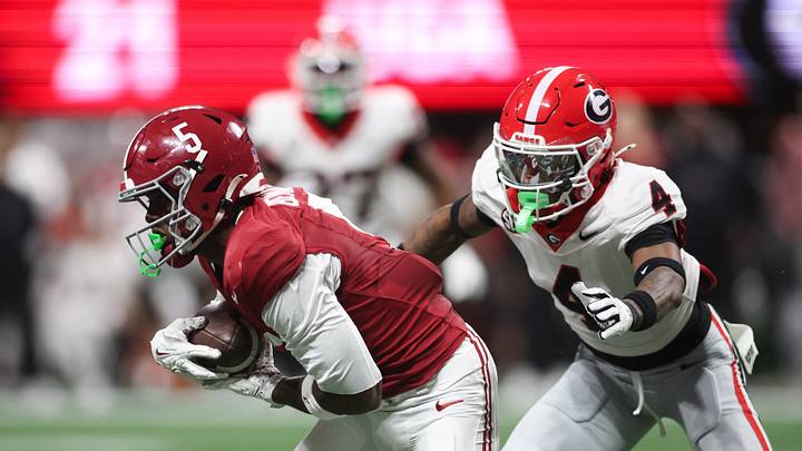 Dec 6, 2025; Atlanta, GA, USA; Alabama Crimson Tide wide receiver Germie Bernard (5) makes a catch as Georgia Bulldogs defensive back Kj Bolden (4) defends during the fourth quarter during the 2025 SEC Championship game at Mercedes-Benz Stadium. Mandatory Credit: Brett Davis-Imagn Images Dec 6, 2025; Atlanta, GA, USA; Alabama Crimson Tide wide receiver Germie Bernard (5) makes a catch as Georgia Bulldogs defensive back Kj Bolden (4) defends during the fourth quarter during the 2025 SEC Championship game at Mercedes-Benz Stadium. Mandatory Credit: Brett Davis-Imagn Images
