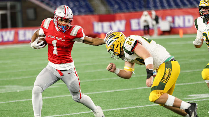 Catholic Memorial's Mekhi Dodd stiff-arms King Philip's Aiden Astorino during a game in the Division 2 Super Bowl at Gillette Stadium on Thursday, Dec. 5, 2024.