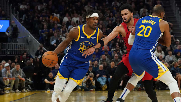 Jan 13, 2026; San Francisco, California, USA;  Golden State Warriors forward Jimmy Butler III (10) dribbles upcourt against Portland Trail Blazers forward Toumani Camara (33) as Golden State Warriors center/forward Al Horford (20) sets a pick in the third quarter at Chase Center. Mandatory Credit: David Gonzales-Imagn Images