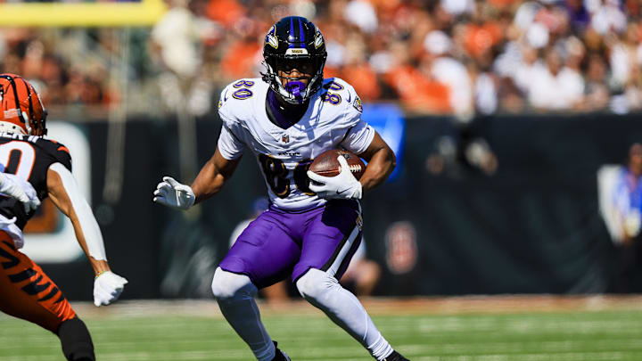 Baltimore Ravens tight end Isaiah Likely runs with the ball against the Cincinnati Bengals.