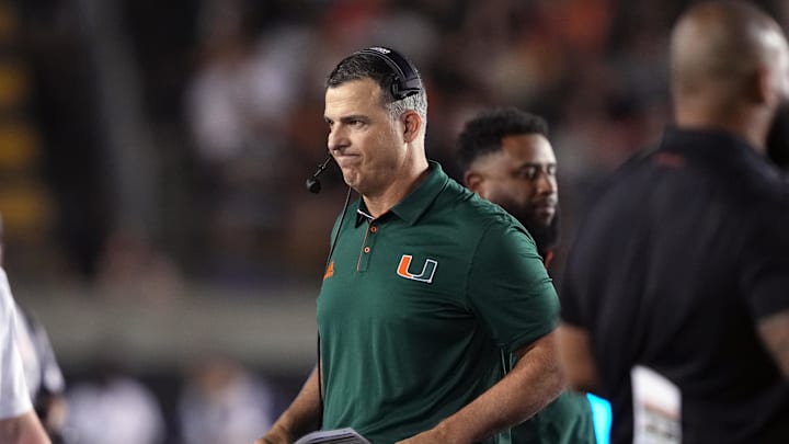 Oct 5, 2024; Berkeley, California, USA; Miami Hurricanes head coach Mario Cristobal walks on the field during a timeout in the second quarter against the California Golden Bears at California Memorial Stadium. Mandatory Credit: Darren Yamashita-Imagn Images