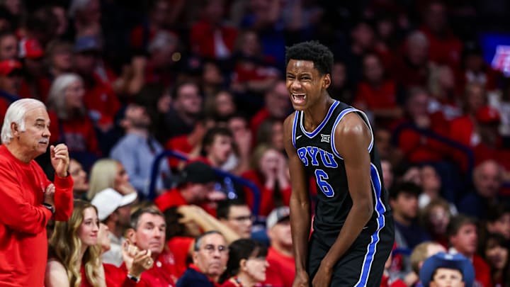 Feb 22, 2025; Tucson, Arizona, USA; BYU Cougars forward Kanon Catchings (6) celebrates after he making a three-point basket during the second half against the Arizona Wildcats  at McKale Center. Mandatory Credit: Aryanna Frank-Imagn Images